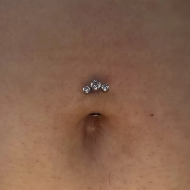 Not every navel is made for a traditional navel piercing… and that’s okay.

One of my favourite parts of piercing is working with someone’s anatomy instead of trying to force something that isn’t going to work.

Ashley Isabella Gunn ✞ was a perfect candidate for a floating navel, so we finished it with this gorgeous three-stone titanium floating navel piece. Clean, elegant and designed to sit beautifully while it heals.

Sometimes the right piercing isn’t the one that’s trending…
It’s the one that’s right for you.

📍Based inside Jaded_Ink 
📲 WhatsApp 084 600 5263

#modifiedmokey 
#floatingnavel 
#navelpiercing 
#titaniumjewellery 
#bodypiercing