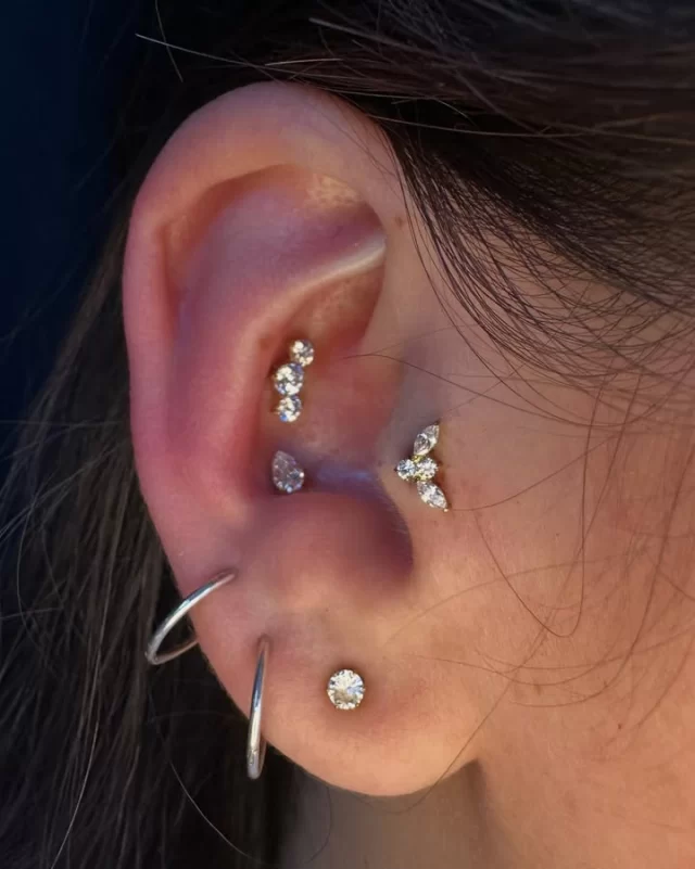 I had so much fun styling this ear with my client, Mel. We played around with a few different ideas before finally settling on this combination… and I absolutely love how it came together.

For this project, we added three fresh piercings and built the look around Gold PVD jewellery from Adora Jewels 

In the tragus, we used the Marquise CZ Cluster with Round Centre. The Triple Bezel Gradient found its home in the high conch (still one of my personal favourites)😍, and we finished everything off with the Bezel Set Pear in the lower conch.

I love having the opportunity everyday to be able to help clients build something that’s unique to them. It’s not about choosing the biggest or flashiest jewellery—it’s about creating a look where every piece works together.

I’d say this one came together beautifully. ✨

📍 Based inside Jaded_Ink 
📲 WhatsApp 084 600 5263
💻 www.modifiedmonkey.co.za

#modifiedmonkey 
#curatedear 
#goldpvd 
#conchpiercing 
#traguspiercing