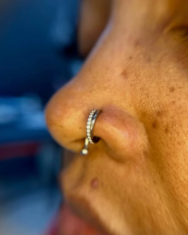 Sometimes, the smallest jewellery change can completely transform a piercing.

This client came in a couple of weeks ago to upgrade the jewellery in her healed nose piercing, and we fitted the Eclipse Twist Clicker from Adora Jewels 

I love how the twisted design brings the CZ pavé detailing together. It catches the light beautifully and gives the piercing something a little different without feeling overdone.

Swipe through the carousel to see how perfectly this piece sits from both angles.

You don’t always need another piercing to create a fresh new look. Sometimes, finding the right jewellery for the piercing you already have is all it takes.

📍 Based inside Jaded_Ink 
📲 WhatsApp: 084 600 5263
💻 www.modifiedmonkey.co.za

#modifiedmonkey 
#nosepiercing 
#jewelleryupgrade 
#adorajewels 
#titaniumjewellery